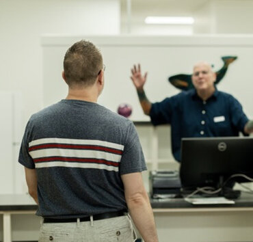 Darren Hart, Owner of Hart Pharmacy, welcoming a Customer into the Pharmacy