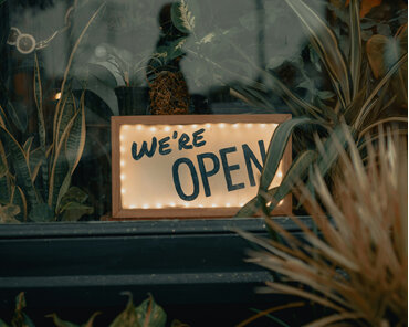 We're open sign in a shop window